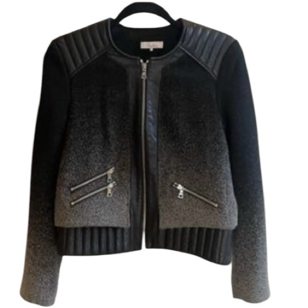 Parker leather and wool jacket. It fits more like a medium.